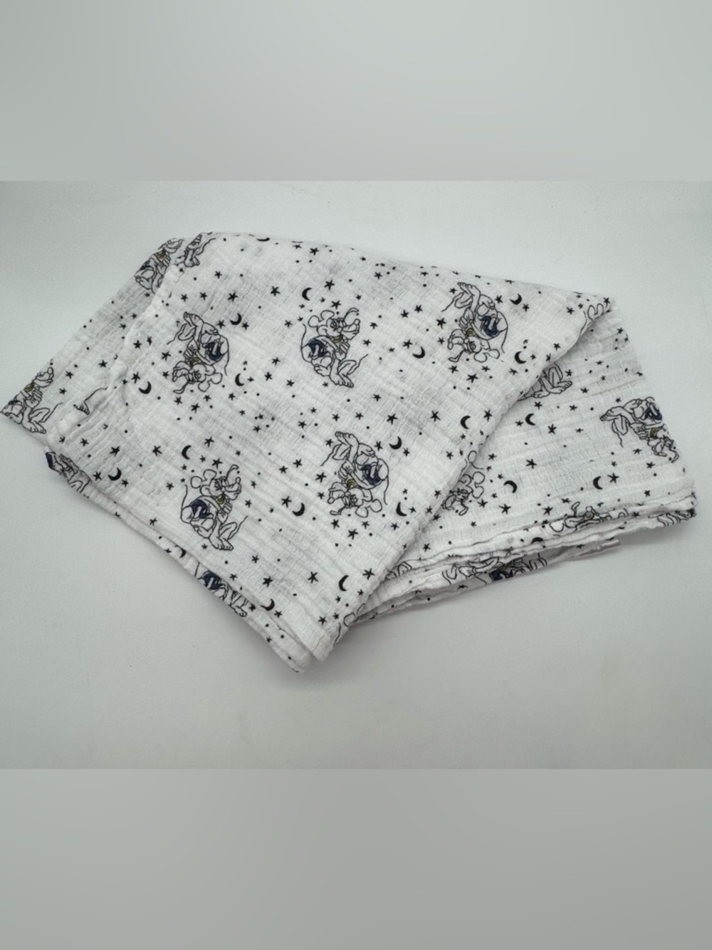 Disney Baby Muslin Swaddle Blanket featuring Mickey and Pluto hugging